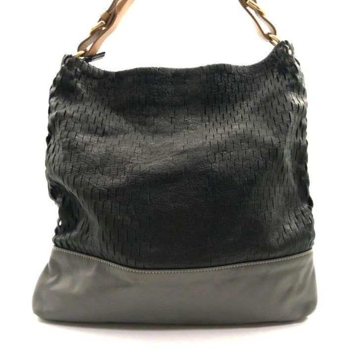 FURLA HOBO BAG (Category: Luxury Bags & Wallets) located in Cavite. Submitted by xjune8x (Listing ID 1439759432, Image 3). Description: FURLA THIS IS A BLACK AND GRAY FURLA HOBO SHOULDER BAG FEATURING A WOWAN UPPER PANEL AND SMOOTH LEATHER BASE. IT HAS MINOR FLAWS...