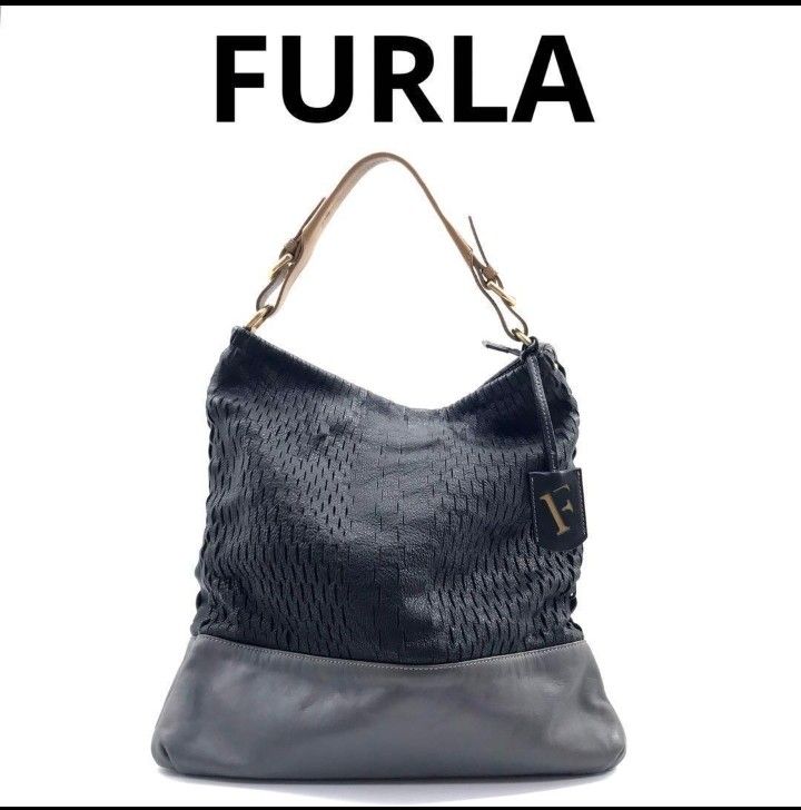FURLA HOBO BAG (Category: Luxury Bags & Wallets) located in Cavite. Submitted by xjune8x (Listing ID 1439759432, Image 1). Description: FURLA THIS IS A BLACK AND GRAY FURLA HOBO SHOULDER BAG FEATURING A WOWAN UPPER PANEL AND SMOOTH LEATHER BASE. IT HAS MINOR FLAWS...