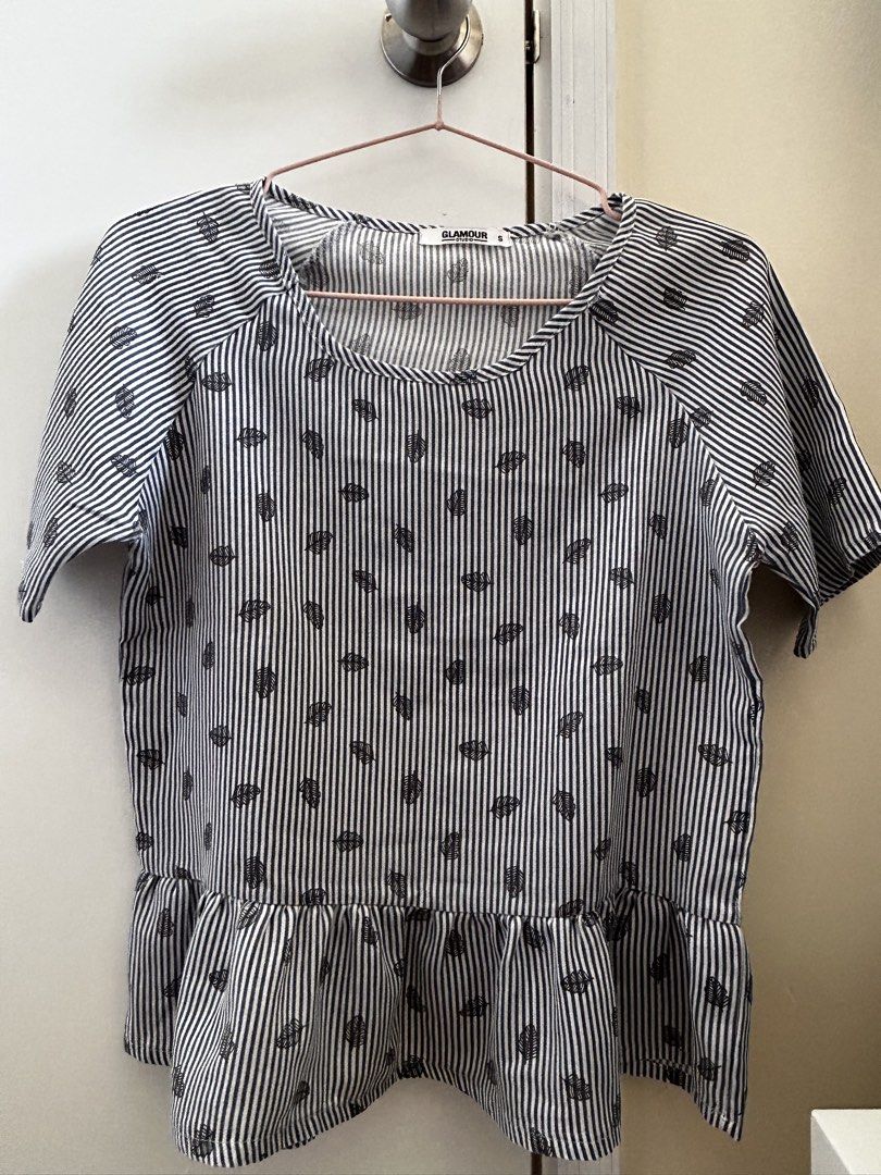 Glamour Striped Leaf Print Top (Category: Blouses) located in Manila. Submitted by jaynojayno (Listing ID 1439618446, Image 1). Description: - Striped pattern with leaf prints - Short sleeves - Ruffled hem - Round neckline - Lightweight fabric - Suitable for casual wear - Simple and stylish design.