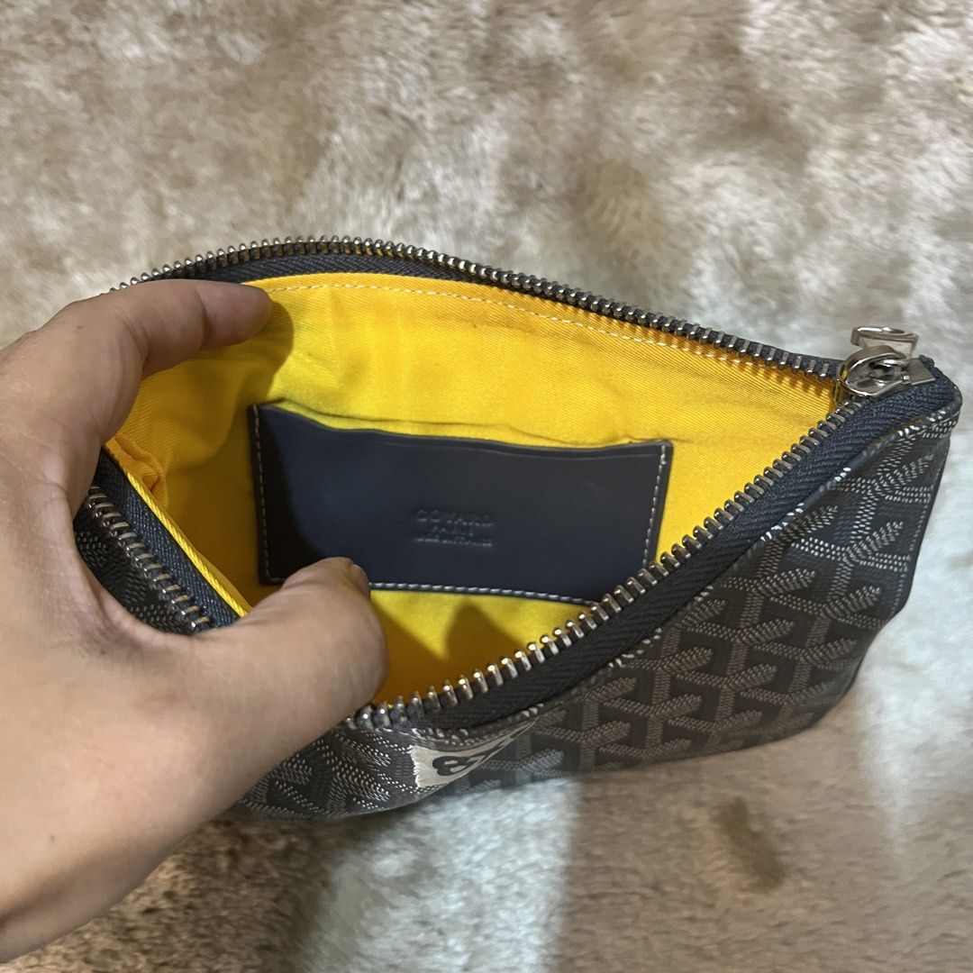 Goyard Honore PM Clutch (Category: Belt bags, Clutches and Pouches) located in Cabadbaran. Submitted by dfgthriftology (Listing ID 1439630290, Image 3). Description: - Goyard Honore PM clutch - Color: Black - Material: Signature Goyardine canvas - Interior: Yellow fabric lining with a small pocket - Closure: Zipper - Dimensions: Approximately 8x5 inches.