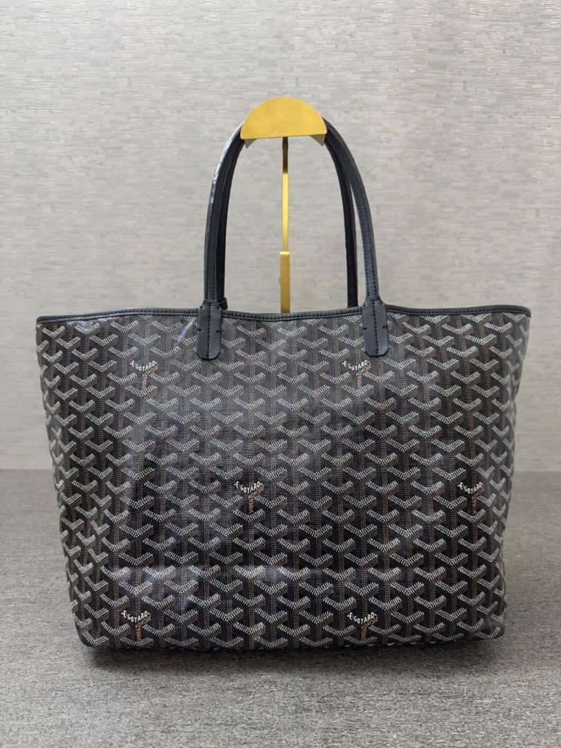 Goyard St. Louis Tote Bag (Category: Luxury Bags & Wallets) located in Manila. Submitted by decluterthings888 (Listing ID 1439751927, Image 3). Description: - Authentic Goyard St. Louis tote bag - Color: Brown and white - Classic Goyardine pattern - Black leather handles - Medium size - Visible wear on handles.