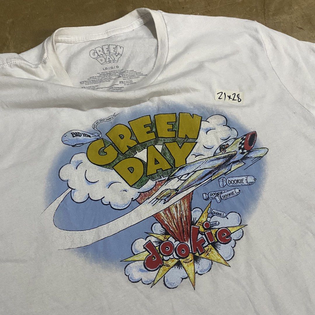 Green Day (Category: Tshirts & Polo Shirts ) located in Makati City. Submitted by kktrippy (Listing ID 1439751571, Image 2). Description: - Green Day - Dookie design - Good condition - Large - Perfect for the scorching heat - Measurement is on the tape 2nd pic.