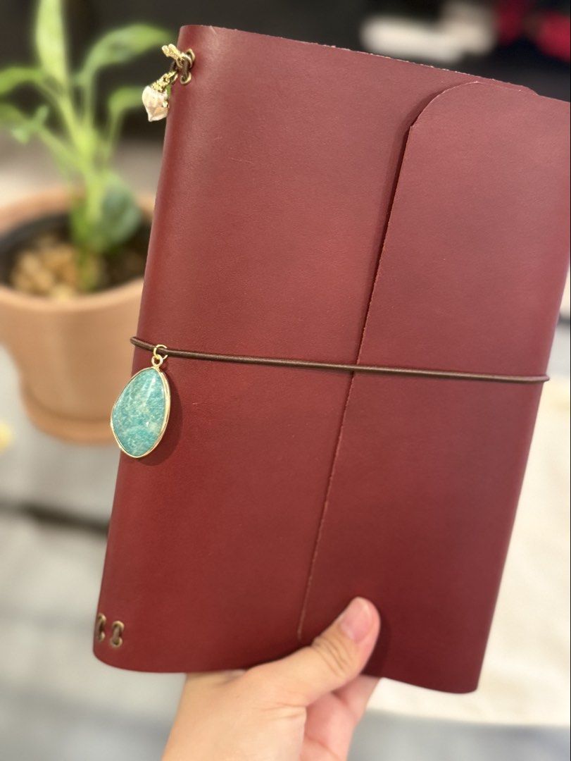 Grotto & Archive A5 Leather Journal in Fig (Category: Stationery & School Supplies) located in Las Pinas. Submitted by patoots (Listing ID 1439731570, Image 3). Description: Lovely leather journal with charms from Grotto & Archive in the color Fig. Brand new; never used, but will age like wine as quality will only get better with use. Made with vegetable-tagged cowhide leather from Italy, charms and protective canvas sleeve included. Bought for P