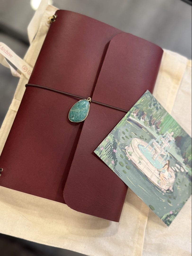 Grotto & Archive A5 Leather Journal in Fig (Category: Stationery & School Supplies) located in Las Pinas. Submitted by patoots (Listing ID 1439731570, Image 2). Description: Lovely leather journal with charms from Grotto & Archive in the color Fig. Brand new; never used, but will age like wine as quality will only get better with use. Made with vegetable-tagged cowhide leather from Italy, charms and protective canvas sleeve included. Bought for P