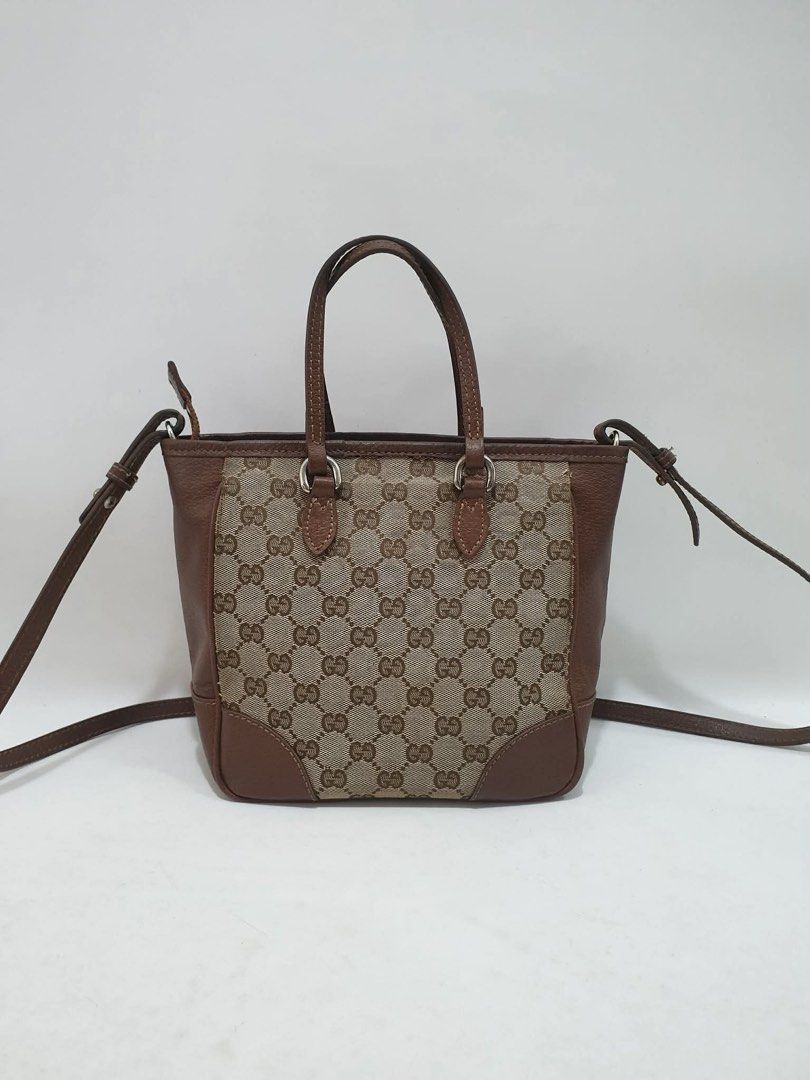 Gucci GG Canvas Tote Bag (Category: Luxury Bags & Wallets) located in Taguig. Submitted by itsjohrecca (Listing ID 1439646329, Image 3). Description: - Authentic Gucci tote bag - Iconic GG canvas design - Brown leather trim and handles - Detachable shoulder strap - Includes metal Gucci charm - Compact size, ideal for daily use.