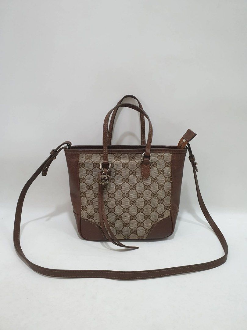 Gucci GG Canvas Tote Bag (Category: Luxury Bags & Wallets) located in Taguig. Submitted by itsjohrecca (Listing ID 1439646329, Image 1). Description: - Authentic Gucci tote bag - Iconic GG canvas design - Brown leather trim and handles - Detachable shoulder strap - Includes metal Gucci charm - Compact size, ideal for daily use.