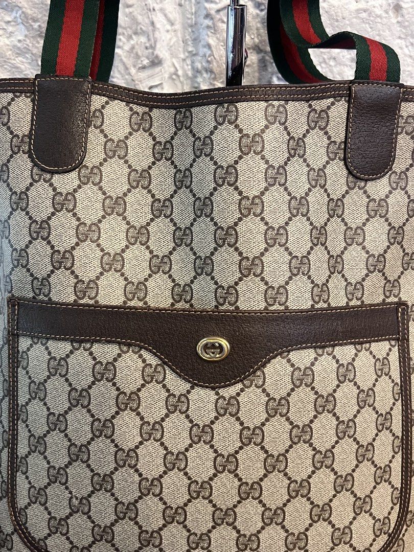 Gucci GG Supreme Tote Bag (Category: Luxury Bags & Wallets) located in Manila. Submitted by lperu71 (Listing ID 1439709328, Image 2). Description: - Authentic Gucci tote bag - Iconic GG Supreme canvas - Front pocket - Green and red stripe straps - Interior leather tag with Gucci logo and "Made in Italy" - Serial number: 40.02.003 - Stylish and functional for everyday use Php 22,500.