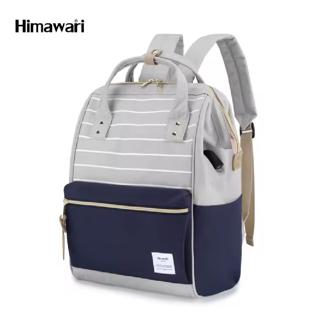 Himawari Holly Daze 15" Laptop Backpack (Category: Backpacks) located in Manila. Submitted by nayachicha (Listing ID 1439647073, Image 2). Description: - Himawari Holly Daze Backpack - Fits up to 15" laptop - Multiple compartments for organization - Water-repellent material - Stylish gray and navy blue color scheme - Top handle for easy carrying - Perfect for casual use CONDITION : - 9/10 (minimal stains on front, message for pictures) - Used a f