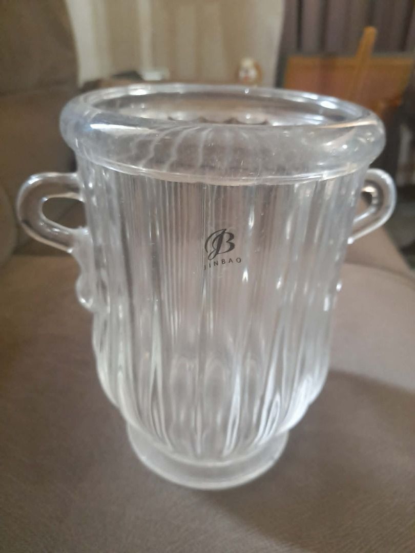 Jinbao Glass Vase with Handles (Category: Vases & Decorative Bowls) located in Cainta. Submitted by patrickwilsonstore (Listing ID 1439666106, Image 1). Description: - Clear glass vase - Two handles - Ribbed design - Features Jinbao logo - Sturdy base - Ideal for flowers or decoration - Versatile for any home decor 1kg in weight 7.5inches 5.3inches diameter Comes with box 750.00 NOW 399.00 .