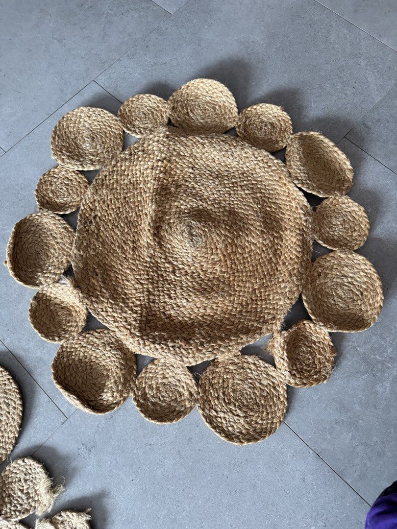 Jute Rug - 100cm x 90cm / 90cm x 90cm (Category: Carpets & Mats) located in Singapore. Submitted by emmatcha (Listing ID 1439609948, Image 3). Description: Beautiful jute rug, perfect for adding a natural touch to your space. Available in two sizes: 100cm x 90cm and 90cm x 90cm. The rug features a unique design with circular and petal-shaped elements. Great condition, ready to enhance your home decor!.