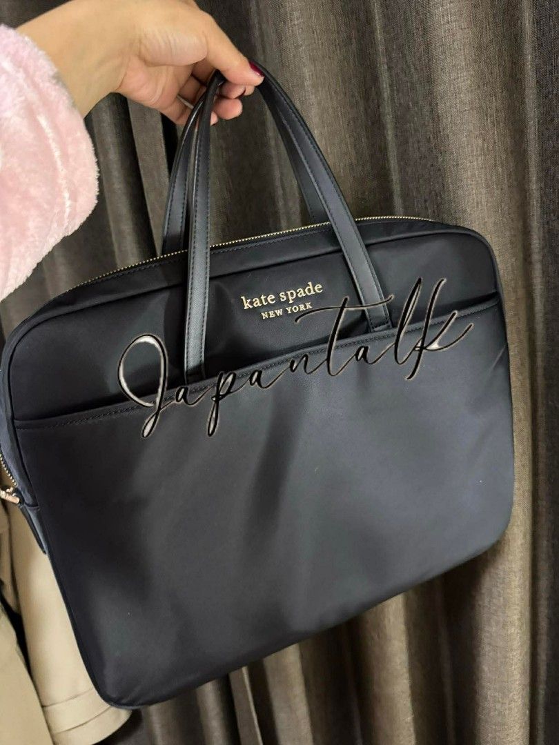 Kate Spade Black Laptop Bag (Category: Laptop Bags & Sleeves) located in Bulacan. Submitted by vintage_purge (Listing ID 1439639912, Image 3). Description: - Black Kate Spade laptop bag - Top handle and detachable shoulder strap - Exterior pocket - Features the Kate Spade New York logo - Made of a nylon-like material - Designed for laptops and essentials.