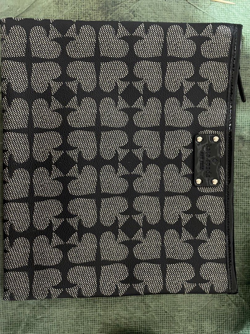 Kate Spade Spade Flower Clutch (Category: Clutches) located in Makati City. Submitted by jiggyboy (Listing ID 1439692954, Image 1). Description: - Kate Spade clutch - Spade flower pattern (black and white) - Flap closure - Small leather Kate Spade logo tag - Textured material - Zipper pull detail.