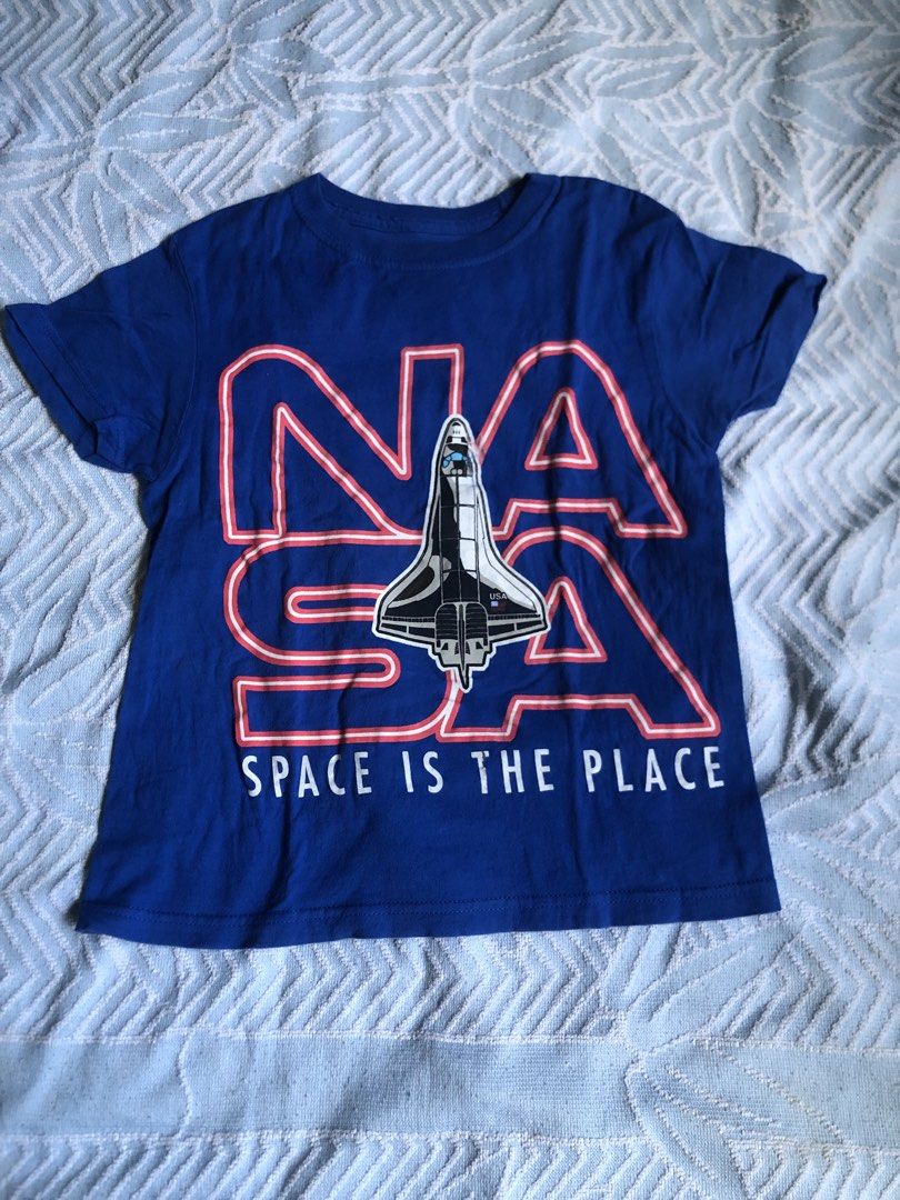 TAKE ALL Kids' Space-themed T-shirts (Category: Babies & Kids Fashion) located in Aliaga. Submitted by imang_13 (Listing ID 1439682037, Image 3). Description: ✅6-7yo ✅like new Set of three kids' t-shirts featuring space-themed designs. One shirt has a space station graphic, another shows an astronaut surfing, and the third displays a NASA logo with a space shuttle. All shirts have short sleeves and are likely made of cotton. Perfect for young spa
