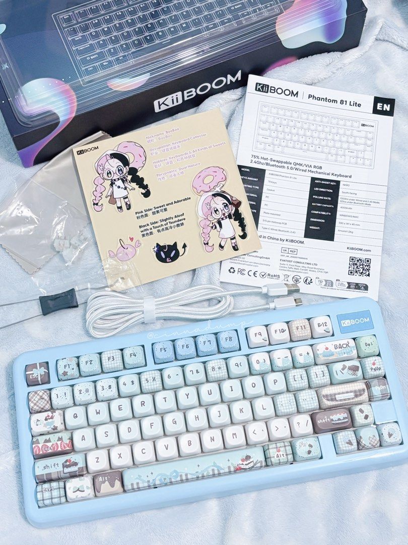 KiiBOOM Phantom 81 Lite Mechanical Keyboard (Category: Computer Keyboard) located in Manila. Submitted by cinnadump.2 (Listing ID 1439760694, Image 1). Description: KiiBOOM Phantom 81 Lite mechanical keyboard. Features 75% hot-swappable QMK/VIA RGB, 2.4Ghz/Bluetooth 5.0 wired mechanical keyboard. Includes original box, accessories, and keycaps. The keyboard has a light blue base with custom keycaps. Includes a USB-C cable..