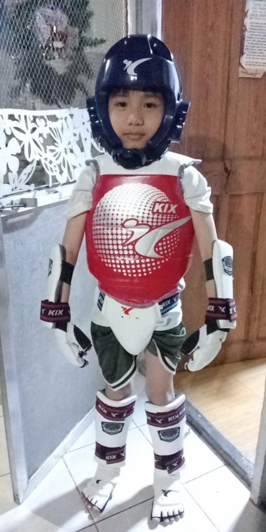 KIX Taekwondo Full Gear Set (Category: Combat Sports) located in Rodriguez. Submitted by erikajeremy (Listing ID 1439664624, Image 1). Description: - Complete KIX Taekwondo gear set for male. - Includes: Headgear, chest protector, arm guards, hand gloves, groin guard, shin guards, and foot gloves. - Comes with a free bag. - Official sponsor of PTA. - Ideal for both training and competition. Never used. Sinukat lang. Size 3 (grade 2-3 kid) Bought 