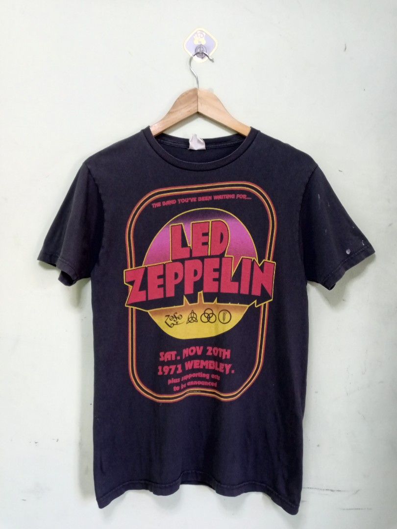Led Zeppelin Wembley 1971 T-shirt (Category: Tshirts & Polo Shirts ) located in Manila. Submitted by onewikstraight (Listing ID 1439651088, Image 1). Description: - Vintage Led Zeppelin t-shirt - Features graphic from the 1971 Wembley concert - Color: Black - Size: M 19 to 20W 28L - Material: 100% Cotton - Brand: Bay Island Sportswear - Includes Led Zeppelin logo and concert details pm cavite location 600+sf.