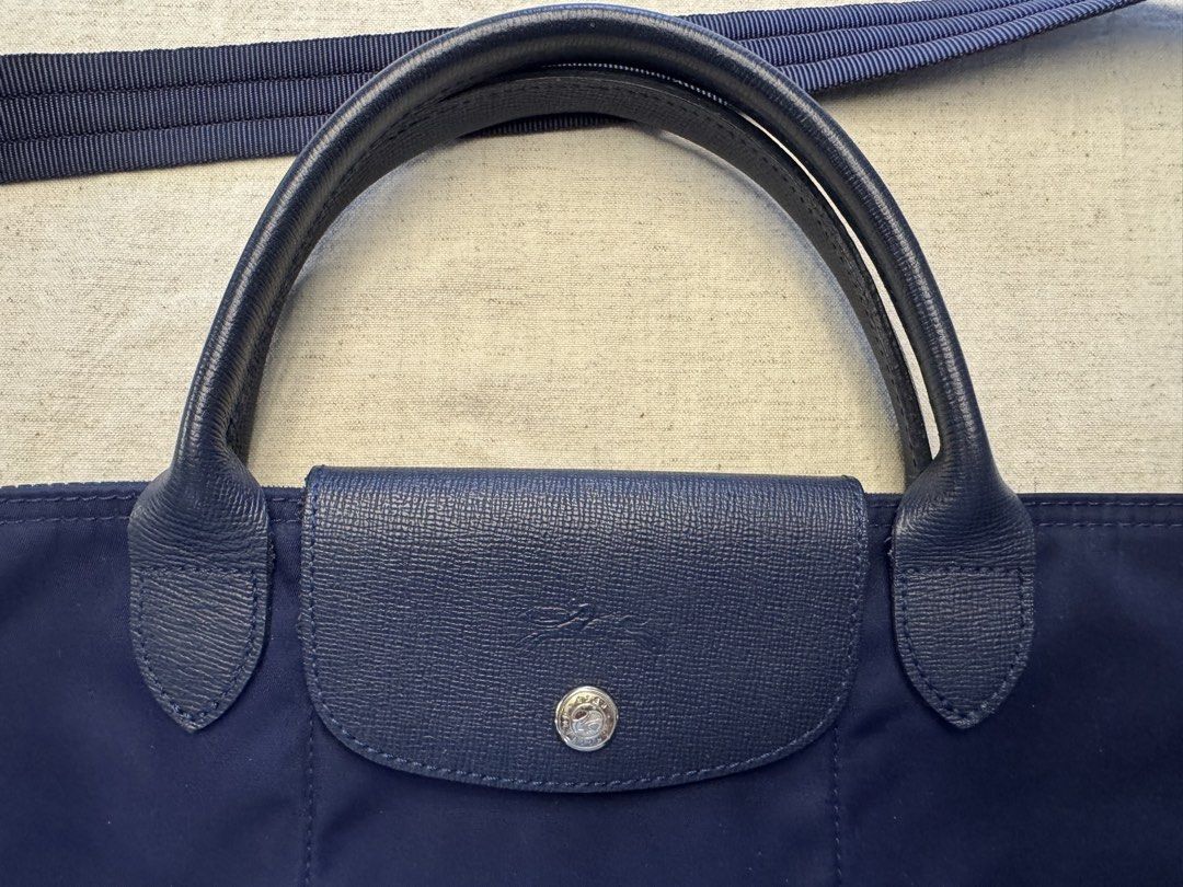 Longchamp Le Pliage Néo Top-Handle Bag Medium Blue (Category: Luxury Bags & Wallets) located in Mandaluyong City. Submitted by marshy (Listing ID 1439785382, Image 3). Description: 💯% authentic, purchased in Spain Has some minor stains but not noticeable Has a faint smell due to storage but should go away once used again .
