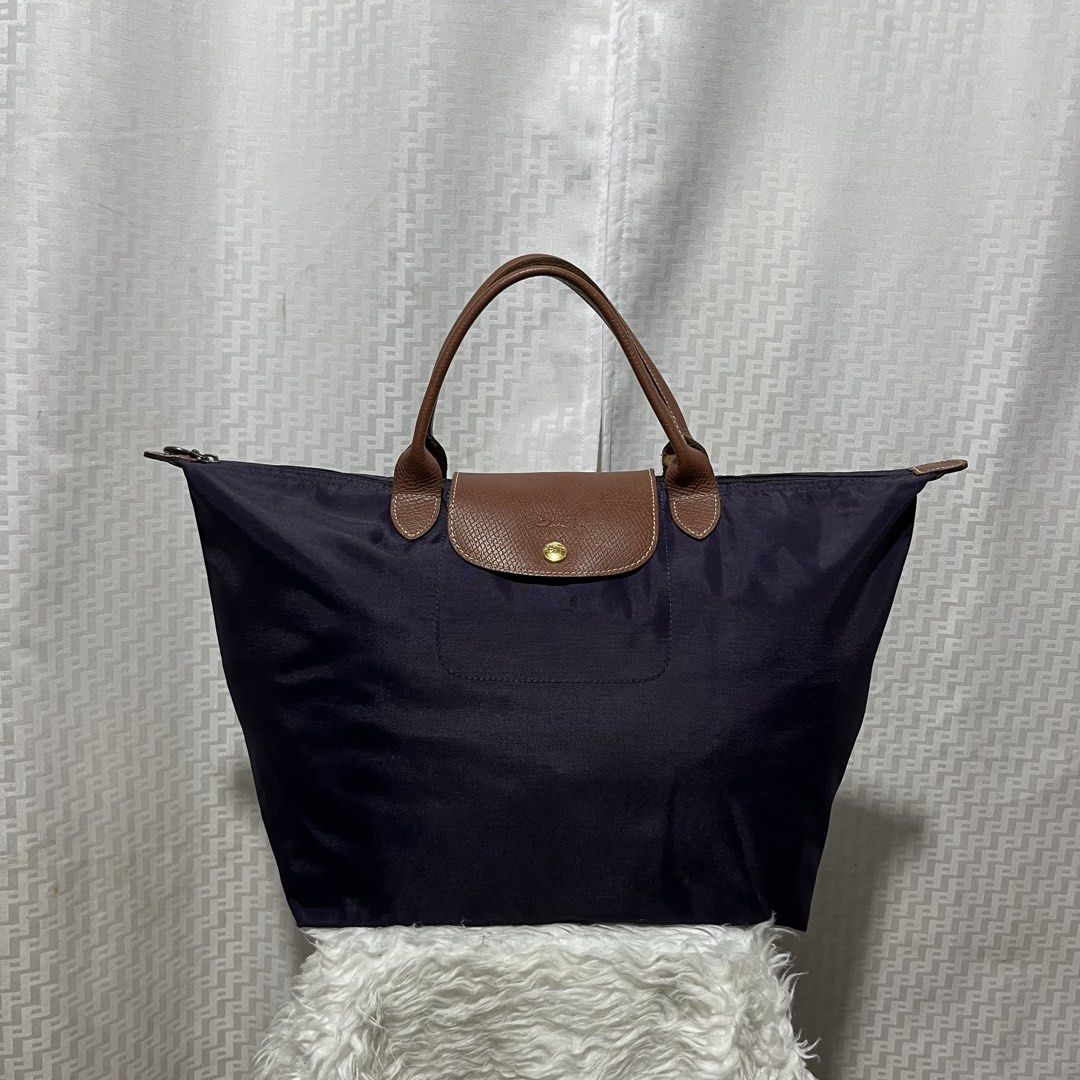 Longchamp le pliage Purple Tote Bag (Category: Announcements) located in Taguig. Submitted by selectthebest (Listing ID 1439691611, Image 1). Description: Longchamp le pliage Purple Tote Bag Authentic Excellent Condition No Issue Taguig City Location Pm Me📩.
