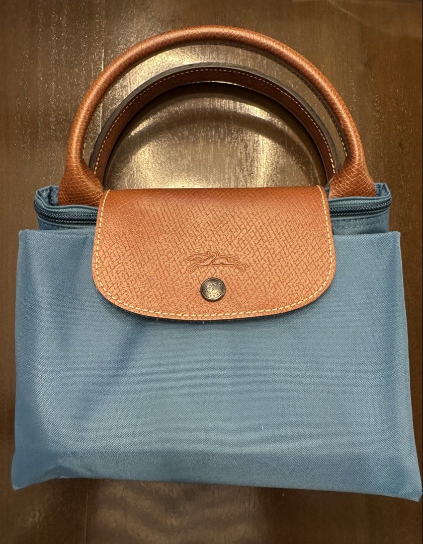 Longchamp Le Pliage Expandable Travel Bag (Category: Luxury Bags & Wallets) located in Mandaluyong City. Submitted by marshy (Listing ID 1439784561, Image 2). Description: 💯% authentic. Please refer to photo for minor flaws. Strap no longer available. .