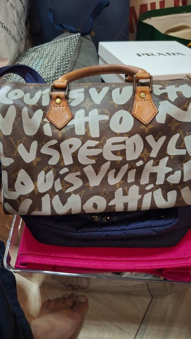 Louis Vuitton Graffiti Speedy 30 (Category: Luxury Bags & Wallets) located in Angono. Submitted by bagamania (Listing ID 1439739975, Image 1). Description: - LV Speedy Stephen Sprouse Graffiti 30 handbag - Features the iconic Graffiti design - Brown leather handles and trim - Secure zipper closure Vintage with flaws and signs of usage .
