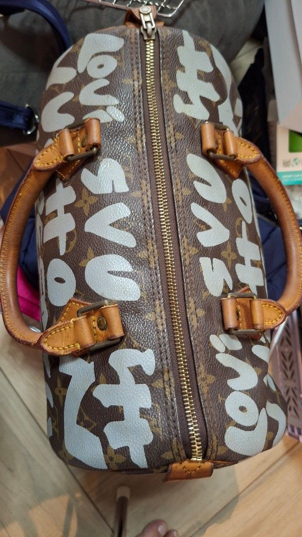 Louis Vuitton Graffiti Speedy 30 (Category: Luxury Bags & Wallets) located in Angono. Submitted by bagamania (Listing ID 1439739975, Image 3). Description: - LV Speedy Stephen Sprouse Graffiti 30 handbag - Features the iconic Graffiti design - Brown leather handles and trim - Secure zipper closure Vintage with flaws and signs of usage .