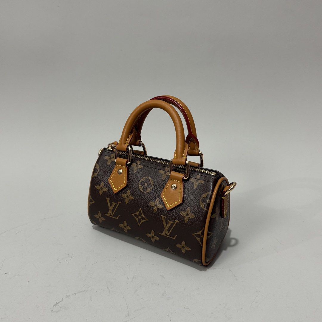 Louis Vuitton Mini Speedy Handbag (Category: Luxury Bags & Wallets) located in Dagupan City. Submitted by thriftygoods.dagupan (Listing ID 1439609375, Image 2). Description: - Authentic Louis Vuitton Mini Speedy handbag - Iconic monogram canvas - Brown leather handles - Gold-tone hardware - Top zipper closure - Detachable shoulder strap - Made in France - Brown interior lining - Compact size.