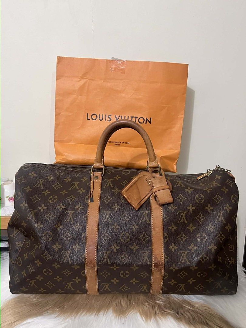 Louis Vuitton Monogram Canvas Duffle Bag (Category: Luxury Bags & Wallets) located in Manila. Submitted by lperu71 (Listing ID 1439708805, Image 1). Description: - Authentic Louis Vuitton duffle bag - Classic Monogram Canvas - Features leather handles and trim - Includes luggage tag - Comes with original Louis Vuitton paper bag - Visible zipper closure Php 23,500.