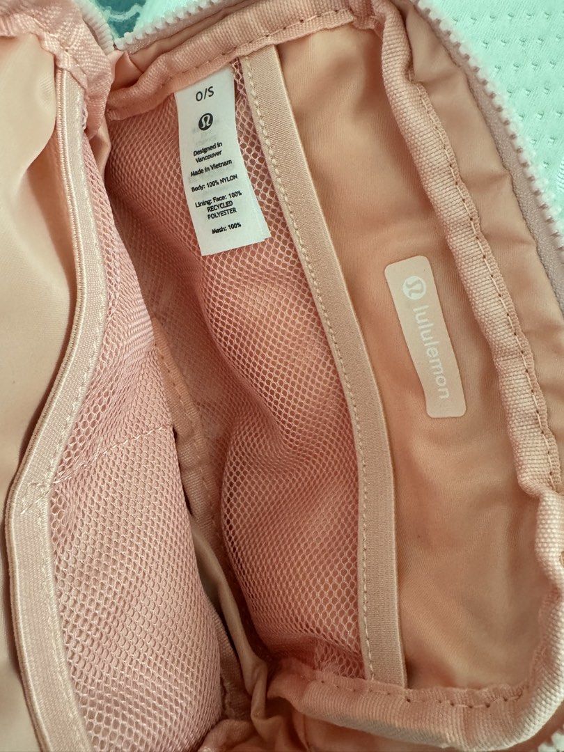 Lululemon Everywhere Belt Bag - Pink (Category: Cross-body Bags) located in Taguig. Submitted by pamraq (Listing ID 1439655596, Image 2). Description: - Lululemon Everywhere Belt Bag - Soft pink color - Main compartment with mesh pocket - Additional slip pocket - Zipper closure - Small Lululemon logo - Made in Vietnam.