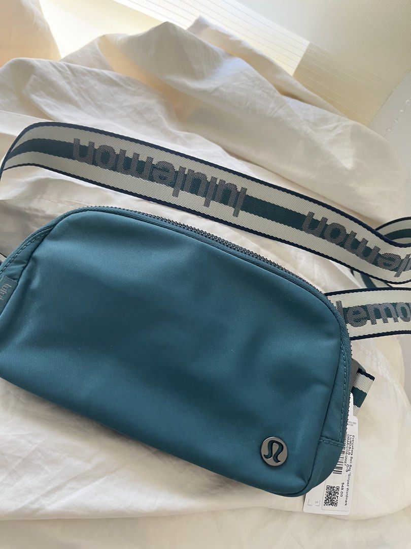 Lululemon Everywhere Belt Bag - Striped Wordmark (Category: Cross-body Bags) located in Quezon City. Submitted by classychicph92 (Listing ID 1439676734, Image 1). Description: - Authentic Lululemon Everywhere Belt Bag - Teal color - Striped wordmark strap - Zippered main compartment - Interior pocket - Metal buckle - Lululemon logo on front - Includes original tags.