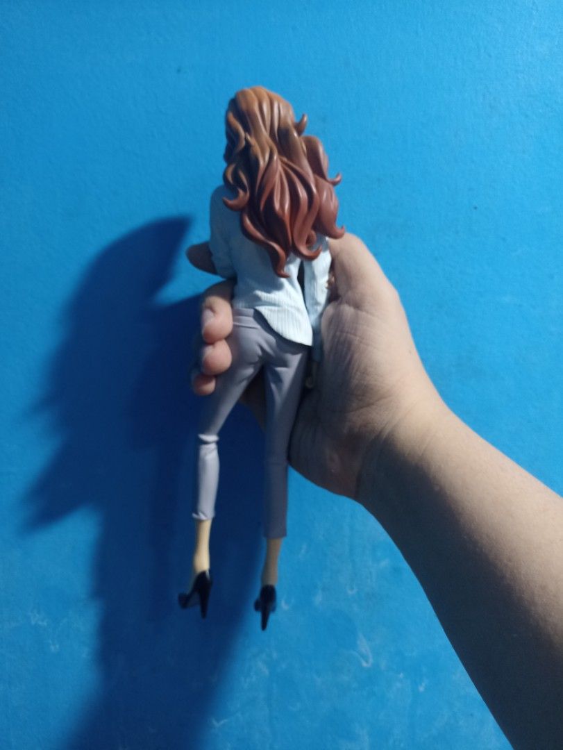 Lupin the Third: Fujiko Mine Figure (Category: Figurines & Statues) located in Manila. Submitted by hobbymo_koleksyon.ph (Listing ID 1439734255, Image 2). Description: - Fujiko Mine figure from Lupin the Third. - Features Fujiko in a white blouse, gray pants, and black heels. - Long, wavy brown hair..