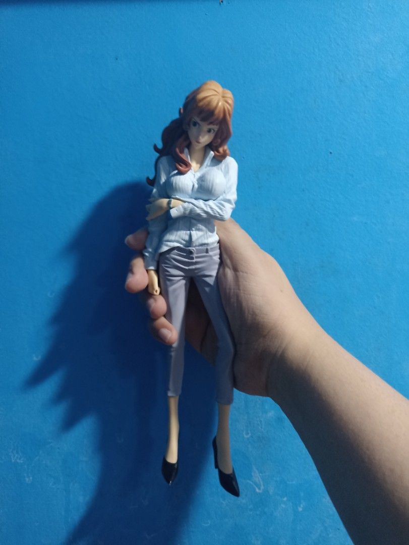 Lupin the Third: Fujiko Mine Figure (Category: Figurines & Statues) located in Manila. Submitted by hobbymo_koleksyon.ph (Listing ID 1439734255, Image 1). Description: - Fujiko Mine figure from Lupin the Third. - Features Fujiko in a white blouse, gray pants, and black heels. - Long, wavy brown hair..