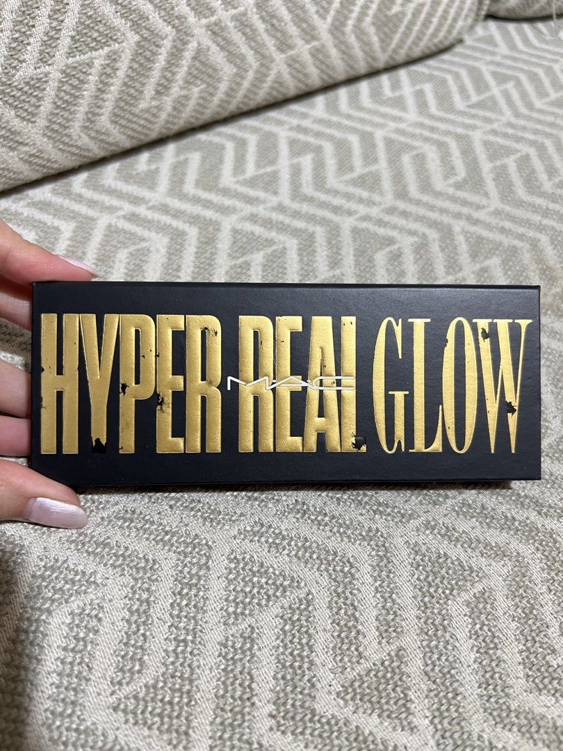 MAC Hyper Real Glow highlighting palette (Category: Makeup) located in Tagaytay City. Submitted by marielfradez (Listing ID 1439651021, Image 1). Description: MAC Hyper Real Glow highlighting palette in Get it Glowing, featuring three gold-toned shades designed for a luminous finish. From US Never been used Flaws: dent sa isang highlighter from opening.