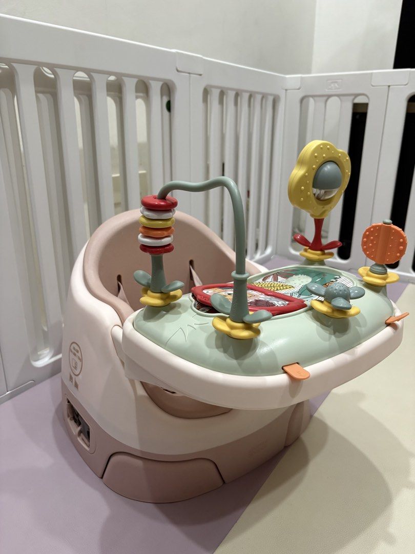 Mamas and papas (Category: Infant Playtime) located in Paranaque City. Submitted by lineasophia (Listing ID 1439712746, Image 3). Description: - Baby seat with activity center. - Soft, pink seat. - Sturdy base for safety. - Includes mirror, spinning toys, and book. - Designed for safe and comfortable play..