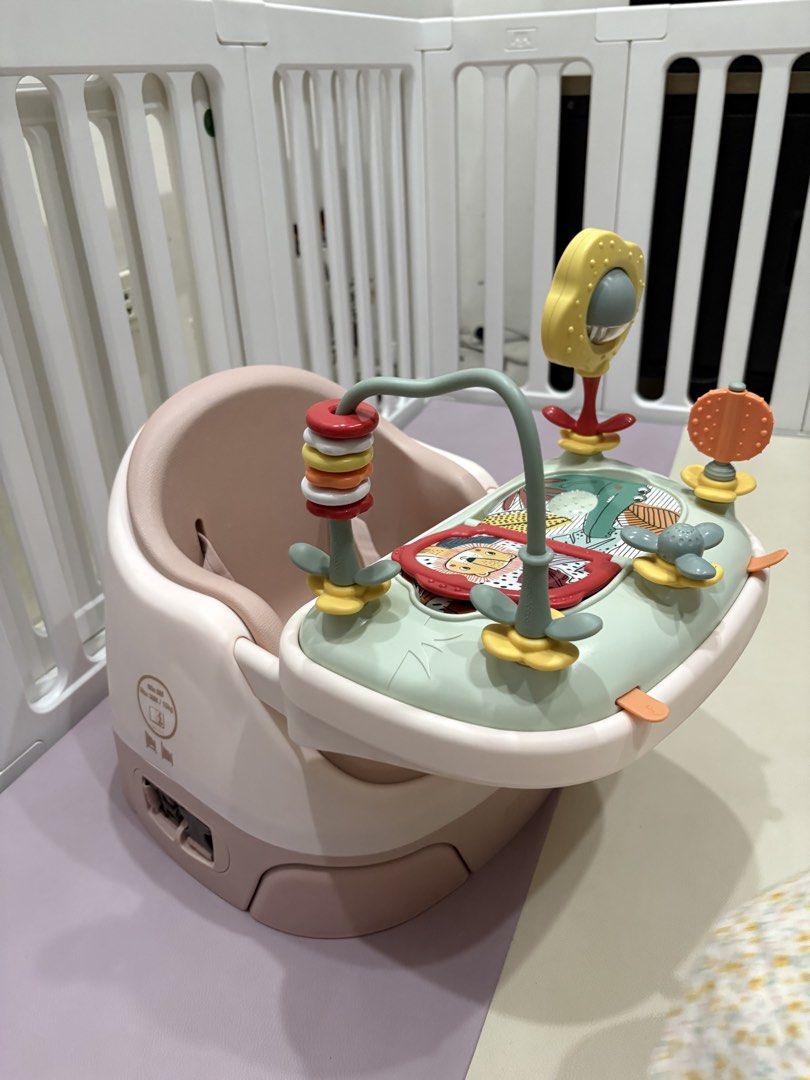 Mamas and papas (Category: Infant Playtime) located in Paranaque City. Submitted by lineasophia (Listing ID 1439712746, Image 2). Description: - Baby seat with activity center. - Soft, pink seat. - Sturdy base for safety. - Includes mirror, spinning toys, and book. - Designed for safe and comfortable play..