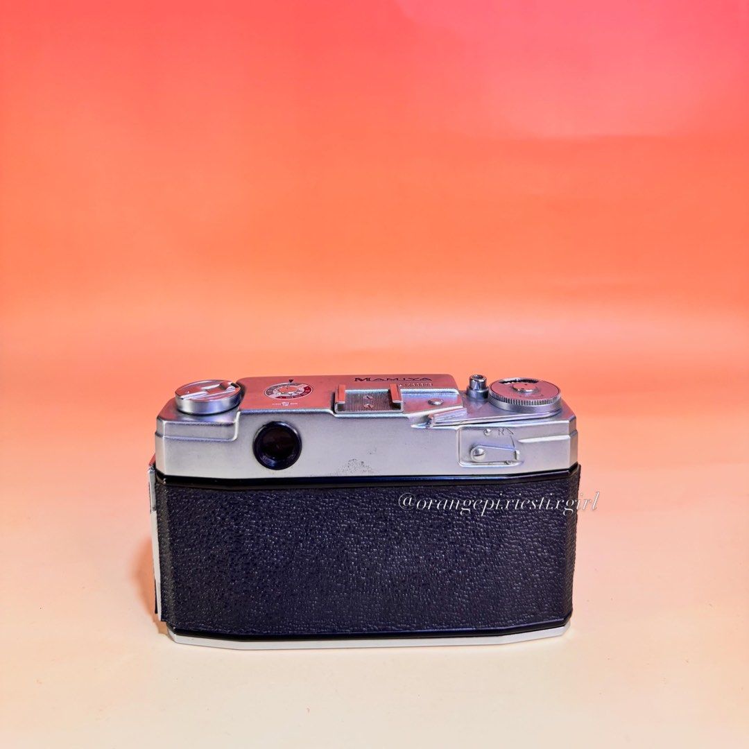 Mamiya 35 S2 35mm Rangefinder Film Camera (Category: Cameras) located in Bulacan. Submitted by orangepixiestixgirl (Listing ID 1439731816, Image 2). Description: ‼️message me on ig, @orangepixiestixgirl for inquiries and transactions‼️ ‼️CAN’T REPLY HERE‼️ Mamiya 35 S2 35mm Rangefinder Film Camera —Fixed helical-focus 48mm Mamiya-Sekor lens, natively available in a bright f/2.8 or rare f/1.9 configuration. —Equipped with a mechanical Copal-SV lea