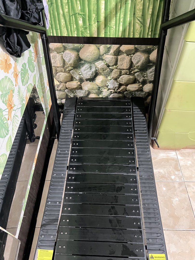 Manual Treadmill (Category: Cardio & Fitness Machines) located in Paranaque City. Submitted by eandcvintageandpreloved25 (Listing ID 1439772689, Image 3). Description: - Manual treadmill - Black running surface - Black frame - Digital display shows '40.1' - Includes warning label - Features 'Attention' label with incline adjustment instructions.