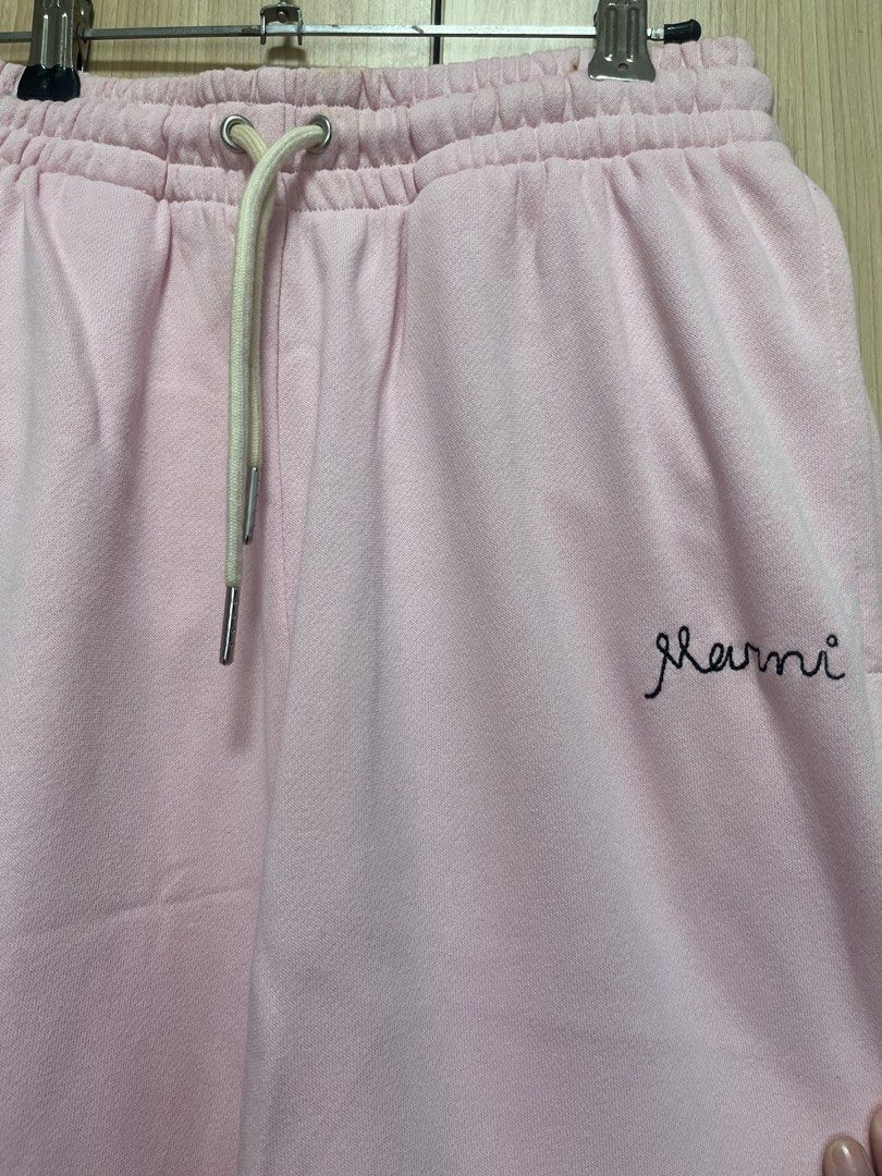 Marni Pink Wide Leg Sweatpants (Category: Other Bottoms) located in Taguig. Submitted by imgthrift (Listing ID 1439667604, Image 2). Description: - Marni pink sweatpants - Wide-leg design - Drawstring waist - Embroidered Marni logo on left leg - Soft and comfortable material - Relaxed fit - Perfect for casual wear -size 36.