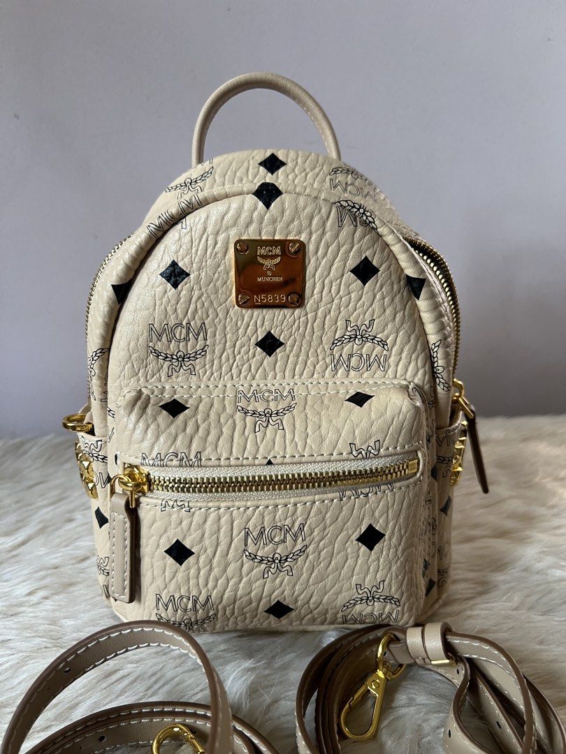 MCM small bag pack convertible (Category: Luxury Bags & Wallets) located in Makati City. Submitted by b.estillo (Listing ID 1439702237, Image 2). Description: MCM small bagpack Can fit small size wallet, preloved, w/ generic dustbag, turnable screws, ykk zipper.