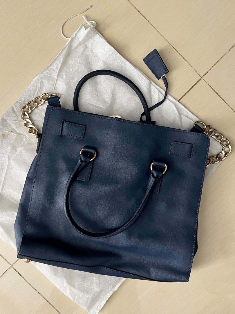 Michael Kors Hamilton Satchel Bag (Category: Luxury Bags & Wallets) located in Manila. Submitted by onnncl (Listing ID 1439650149, Image 3). Description: - Authentic Michael Kors Hamilton satchel - Navy blue color - Gold-tone lock and chain strap - Top handle and detachable tag - Includes dust bag.