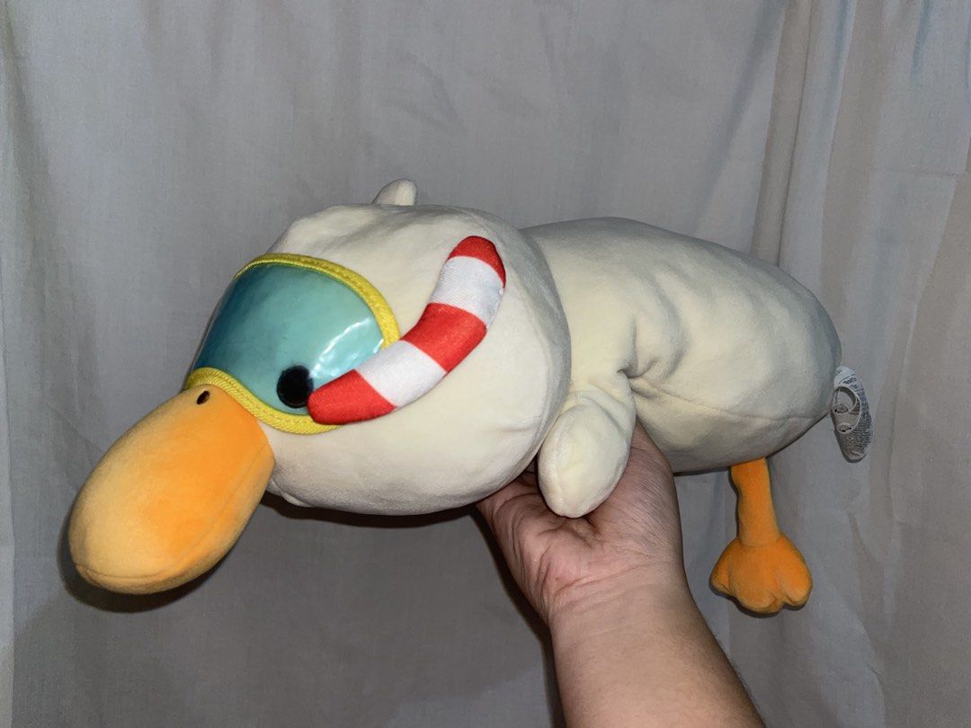 MINISO Duck Plush Toy with Snorkel (Category: Plushies & Soft Toys) located in Manila. Submitted by mightylion.aa32e0 (Listing ID 1439746107, Image 2). Description: - Adorable duck plush toy - Features a snorkel and goggles - Bright orange beak and feet - Soft, cream-colored plush - Well-made - Perfect for cuddling or decoration.