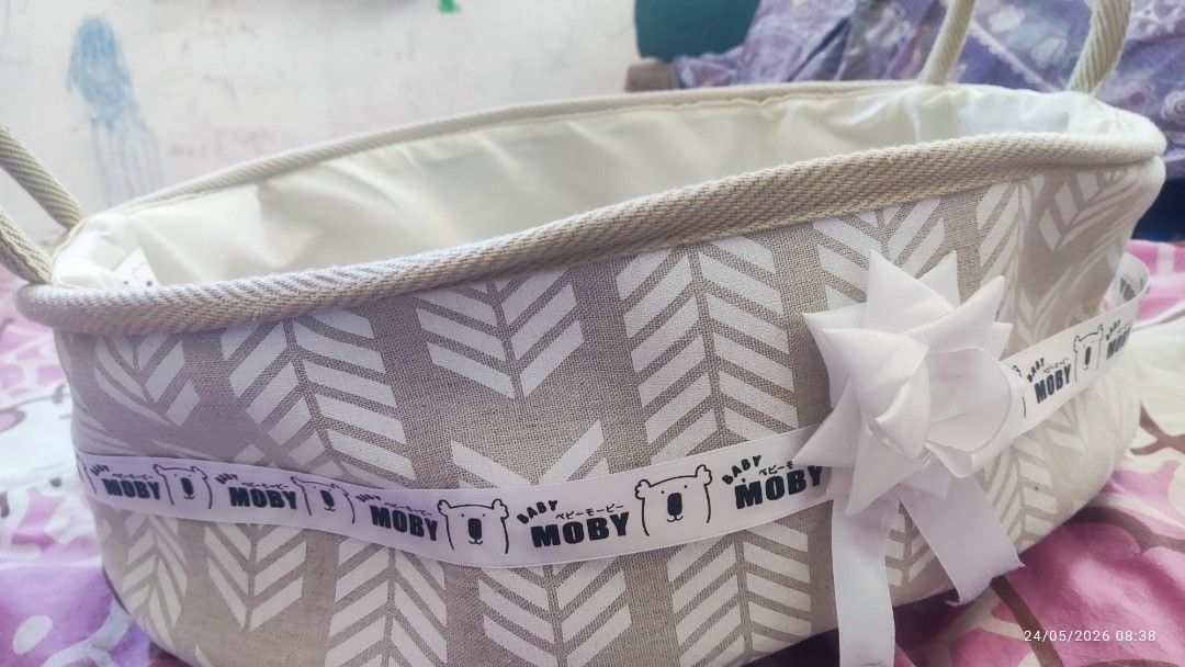 Moby Baby Basket (Category: Other Babies Going Out Needs) located in Manila. Submitted by ruane_raleigh12 (Listing ID 1439671051, Image 1). Description: - Moby baby basket - Neutral color scheme - Decorative ribbon - Chevron pattern exterior - Soft interior lining - Sturdy handles - Unused condition.