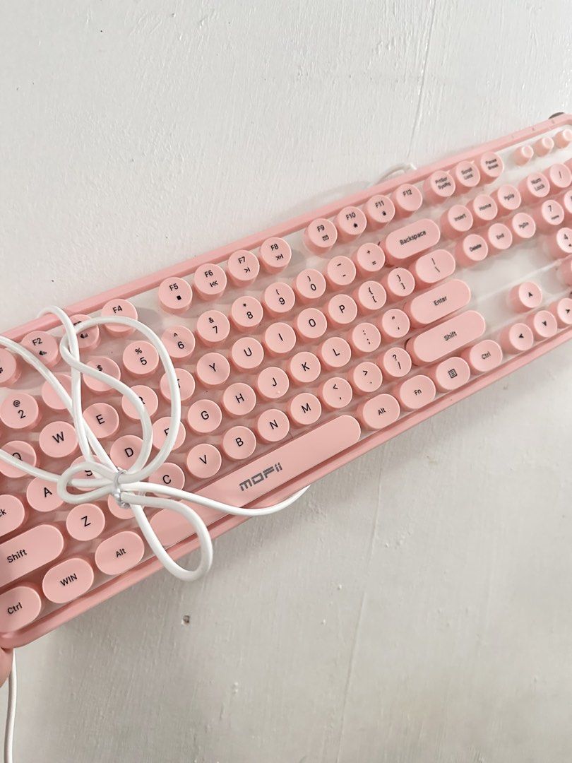MOFII Pink Round Keycap Keyboard (Category: Computer Keyboard) located in Manila. Submitted by heryet (Listing ID 1439679697, Image 2). Description: - Pink MOFII keyboard - Round keycaps - Retro aesthetic - Standard layout with function keys and number pad - White cable - Pink keys with white lettering.