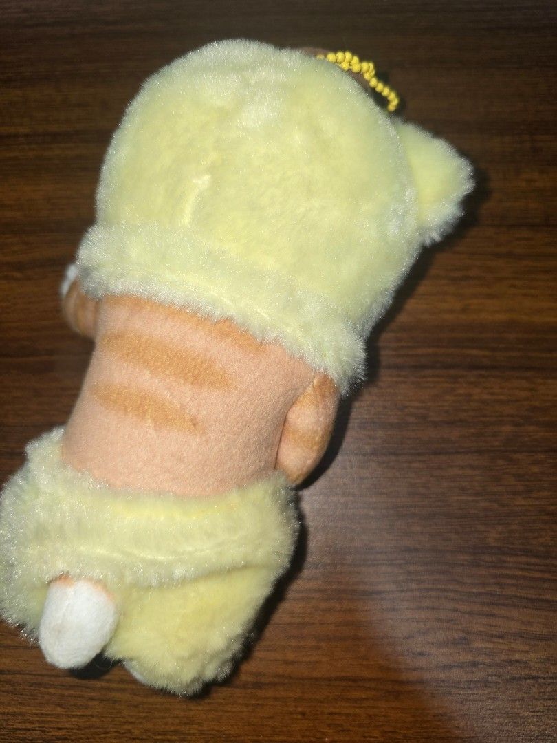 Mofusand Cat Plush Toy x Sanrio (Category: Toys & Games) located in Manila. Submitted by nammie968 (Listing ID 1439637066, Image 2). Description: - Adorable Mofusand cat plush toy - Features a cute cat in a yellow outfit - Includes original tag - Soft and cuddly material - Detailed embroidery - Comes with a small keychain - Perfect for collectors or gifting.