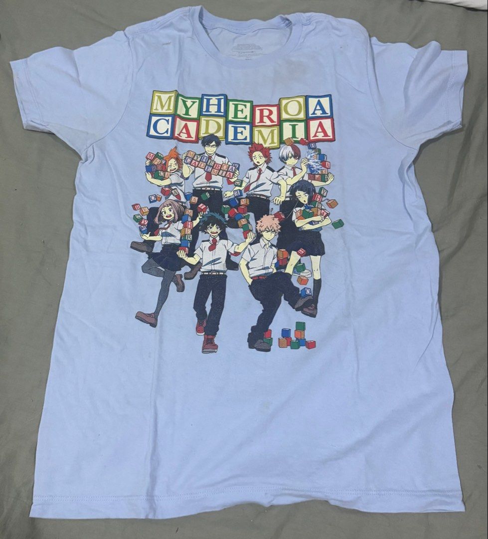 My Hero Academia Funimation T-shirt - Medium (Category: Tshirts & Polo Shirts ) located in Makati City. Submitted by definehipster (Listing ID 1439774061, Image 1). Description: - My Hero Academia t-shirt - Light blue color - Size: Medium - Material: 100% cotton - Graphic: Funimation licensed - Style: Crew neck, short sleeves - Flaw: Shows visible stains and signs of usage RFS: decluttering .
