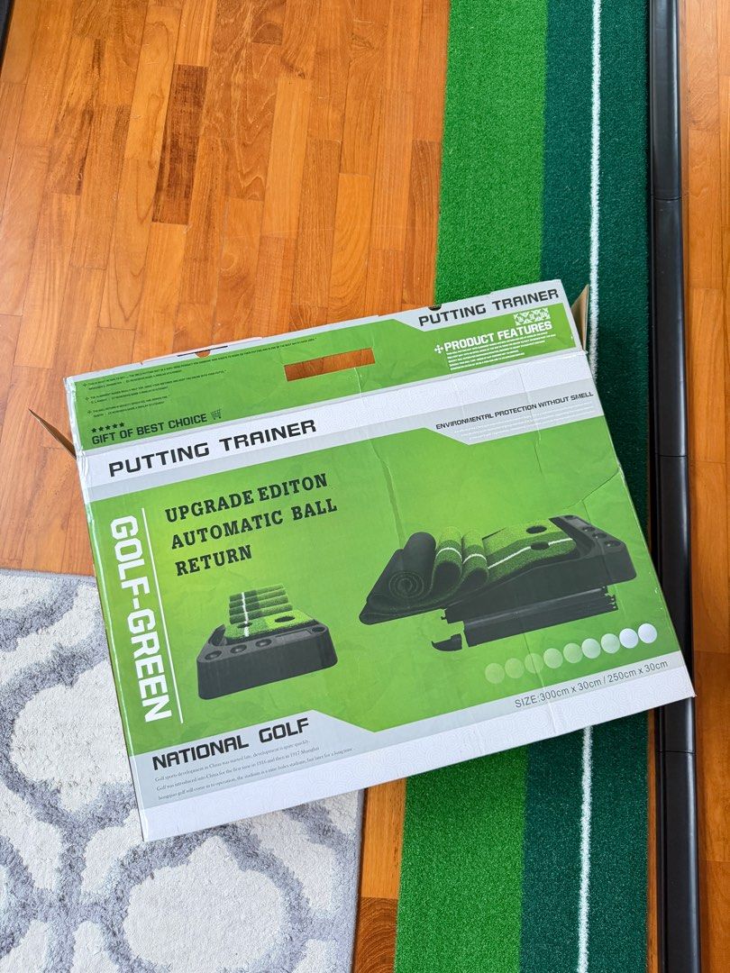 National Golf Putting Trainer with Automatic Ball Return (Category: Golf) located in Singapore. Submitted by nyimapratten (Listing ID 1439733230, Image 2). Description: - Brand new National Golf Putting Trainer - Features automatic ball return - Putting green size: 300cm (L) x 30cm (W) - Ideal for indoor golf practice - Comes with original packaging.