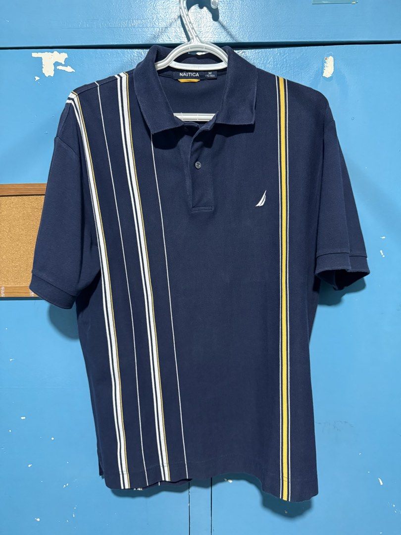 Nautica Striped Polo Shirt - Medium (Category: Tshirts & Polo Shirts ) located in Las Pinas. Submitted by voilecabrera (Listing ID 1439746096, Image 1). Description: - Navy blue Nautica polo shirt - Vertical stripes design - Classic polo collar - Short sleeves - Features the Nautica logo - Size: Medium (M) Location: Pioneer st Mandaluyong or Makati (tuesday to friday) Las pinas (saturday to monday).