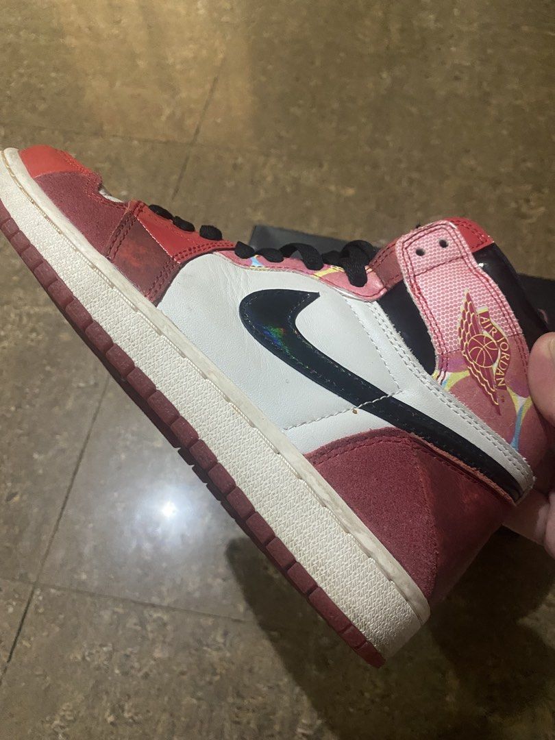 Nike Air Jordan 1 High OG (Category: Sneakers) located in Binan City. Submitted by maggierabi01434 (Listing ID 1439644435, Image 3). Description: - Nike Air Jordan 1 High OG sneakers - Color: Red, white, and black - High-top design - Size: US 7 - Features the classic Nike swoosh - Comes with the original box - Black laces and red/white sole.