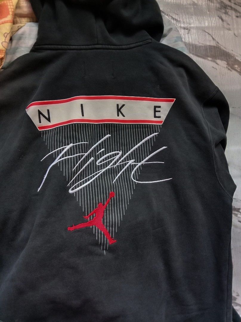 Nike Jordan Flight Hoodie (Category: Coats, Jackets and Outerwear) located in Manila. Submitted by peeweemend69204 (Listing ID 1439608183, Image 2). Description: - Nike Jordan Flight hoodie - Features Flight logo on front and back - Includes Nike logo and "Flight" on the back - Has a front pocket - Comes with a hood - Tag visible in images.