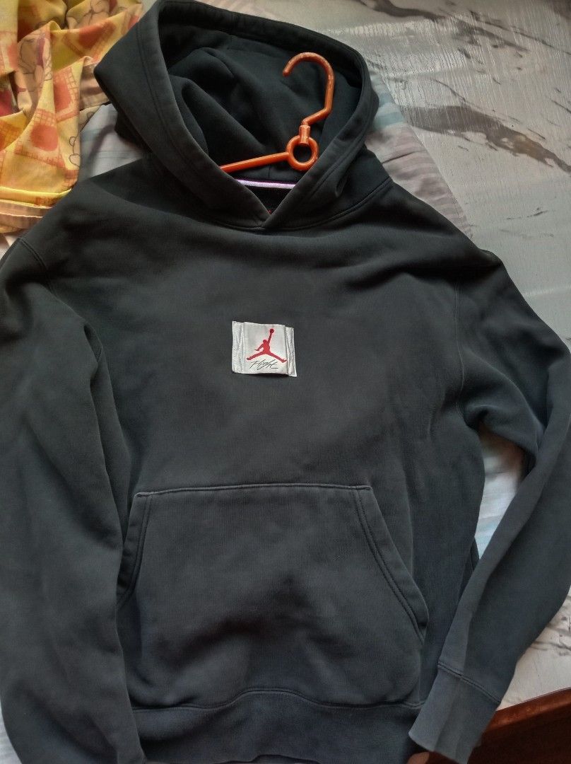 Nike Jordan Flight Hoodie (Category: Coats, Jackets and Outerwear) located in Manila. Submitted by peeweemend69204 (Listing ID 1439608183, Image 1). Description: - Nike Jordan Flight hoodie - Features Flight logo on front and back - Includes Nike logo and "Flight" on the back - Has a front pocket - Comes with a hood - Tag visible in images.