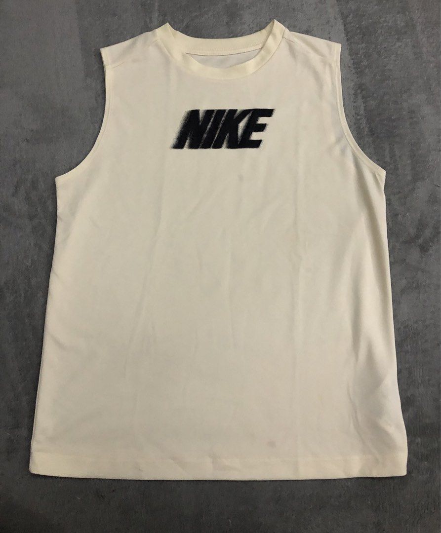 Nike Sleeveless Shirt XL (Category: Activewear) located in Quezon City. Submitted by go.thriftandtrends (Listing ID 1439645401, Image 1). Description: - Cream-colored Nike sleeveless shirt - Features a black Nike logo - Crew neck design - Made of lightweight material - Ideal for sports or casual activities - Versatile neutral color.
